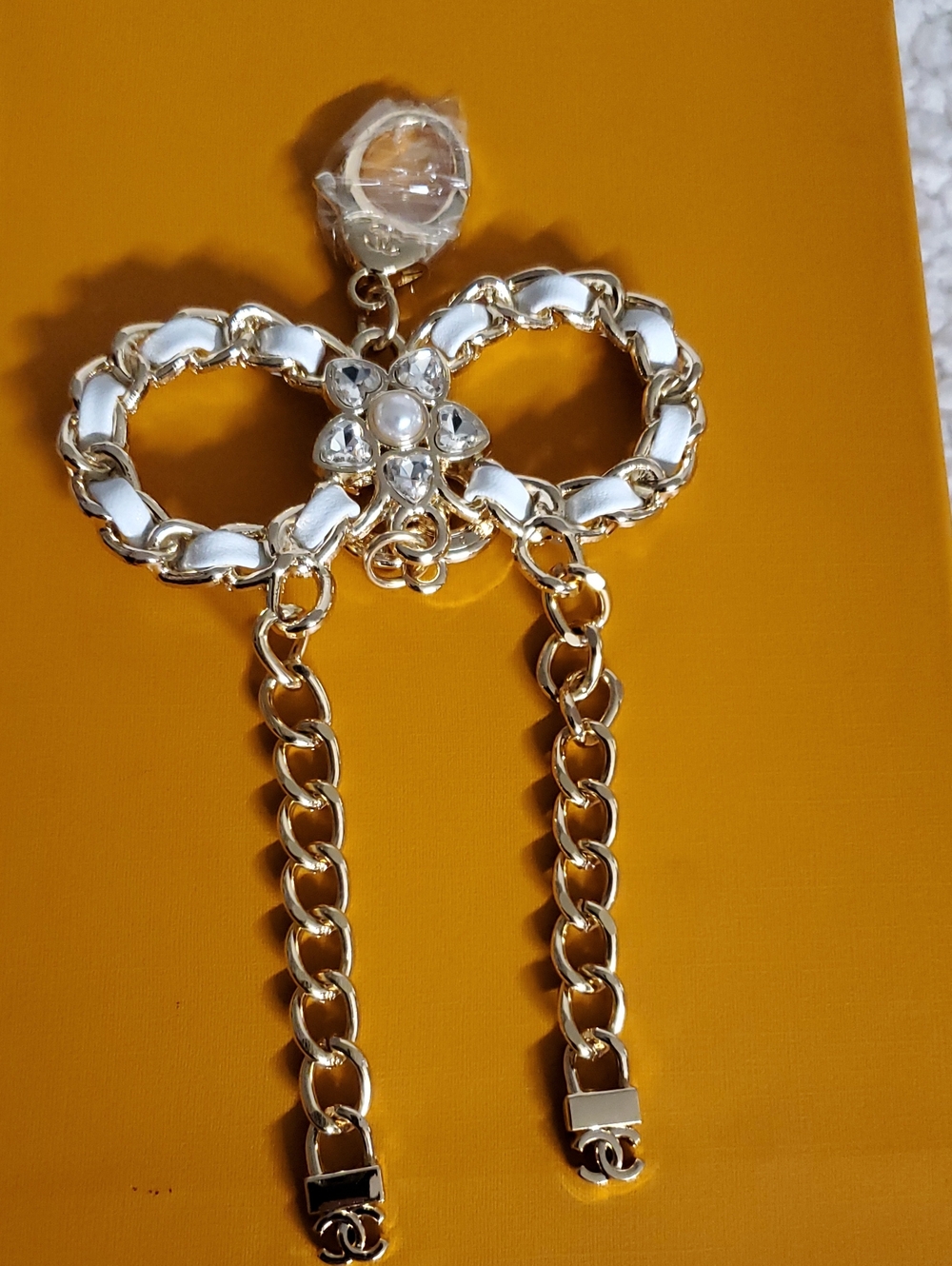 CC Boutique Gold and White Bow Drop Earrings with Pearl & Crystal Detail